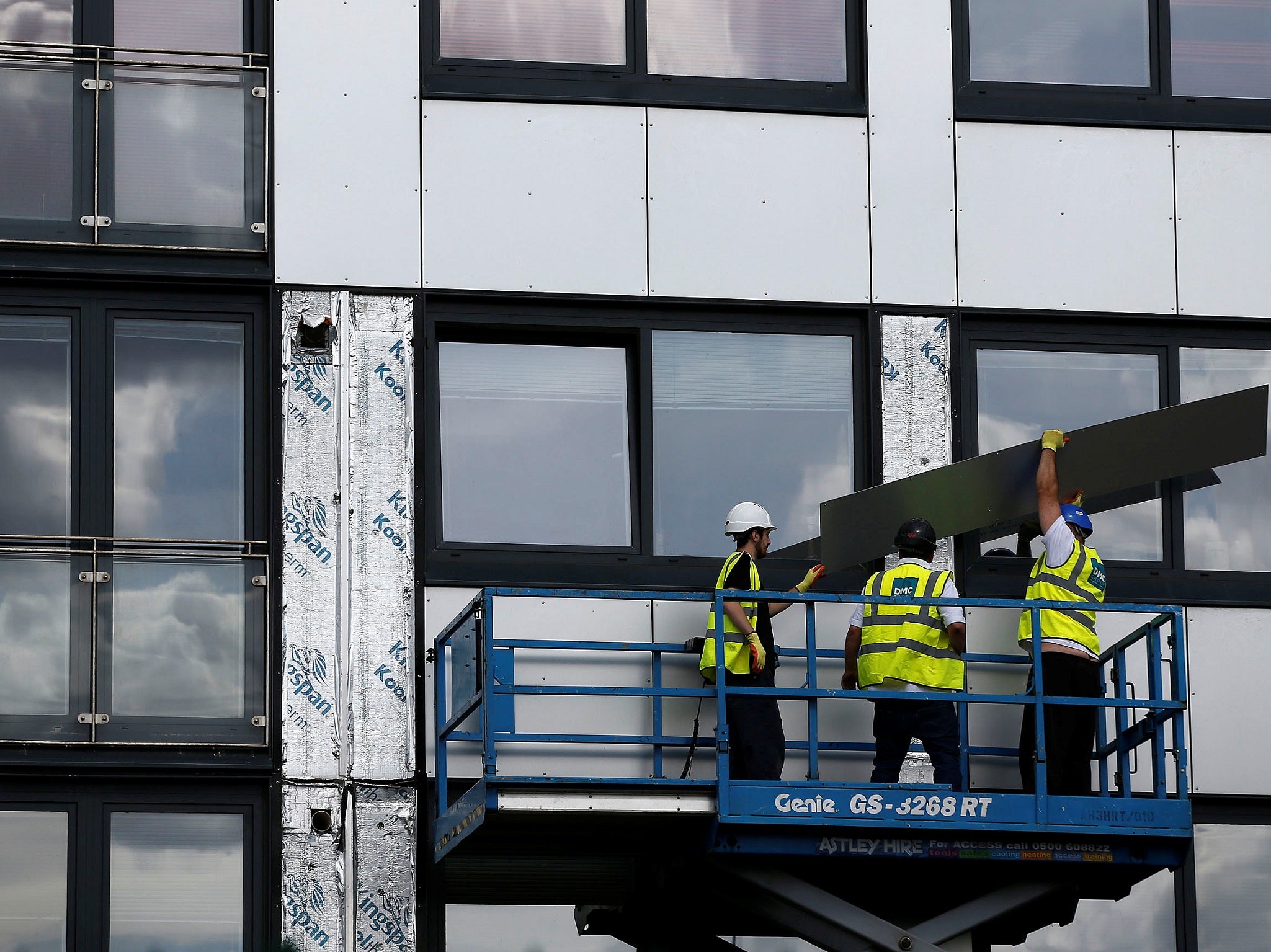 Cladding is removed from the side of Whitebeam Court in Salford