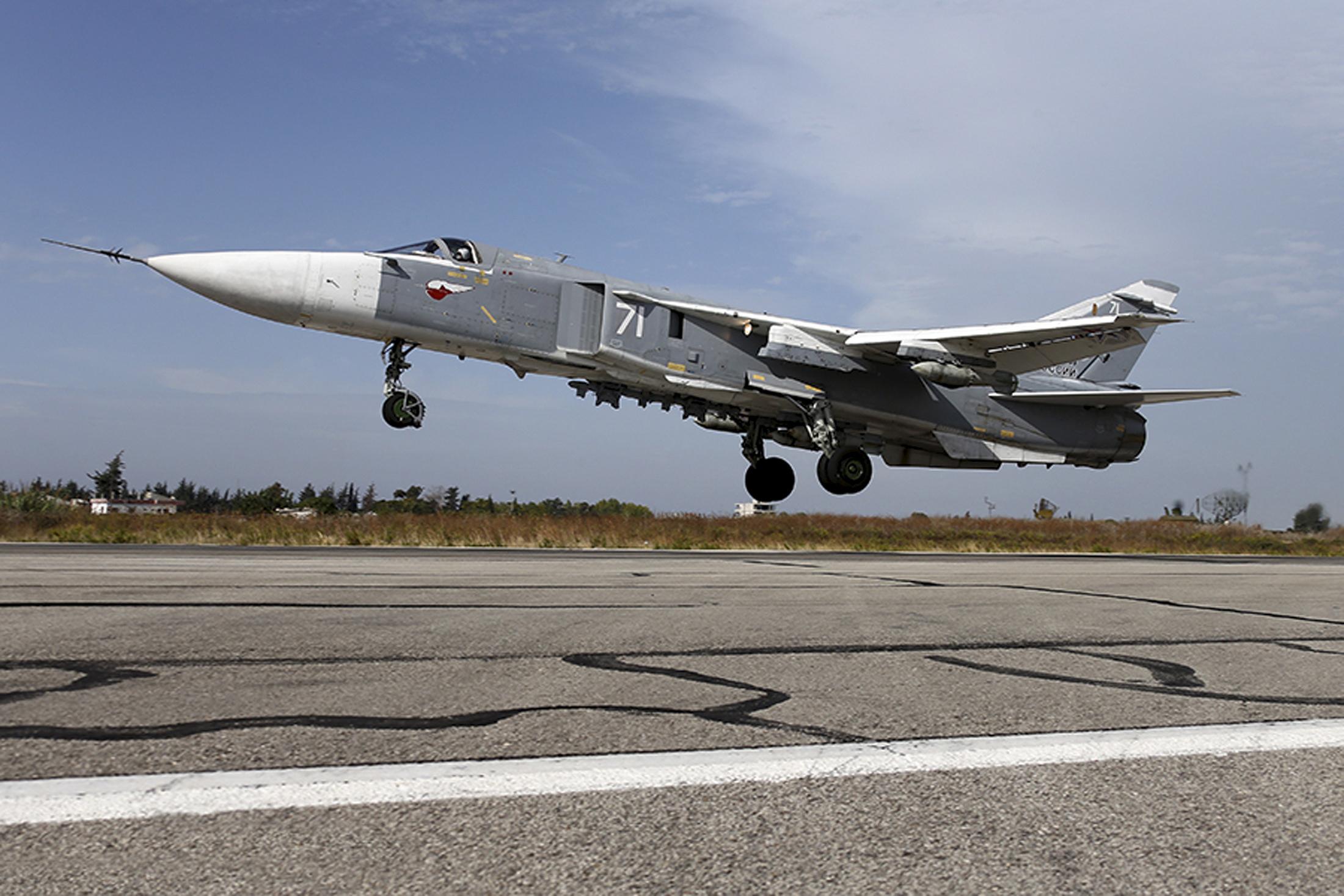 A Sukhoi Su-24 fighter jet takes off from the Hmeymim air base near Latakia, Syria, in this handout photograph released by Russia's Defence Ministry on 22 October, 2015. Russian, Syrian and US-led coalition aircraft are known to conduct sorties in the area hit on Wednesday
