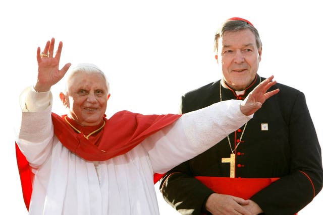 Pope Benedict XVI (L) acknowledges the crowd of World Youth Day pilgrims before giving an address in Sydney July 17, 2008, as Australia's senior Catholic cleric Cardinal George Pell looks on
