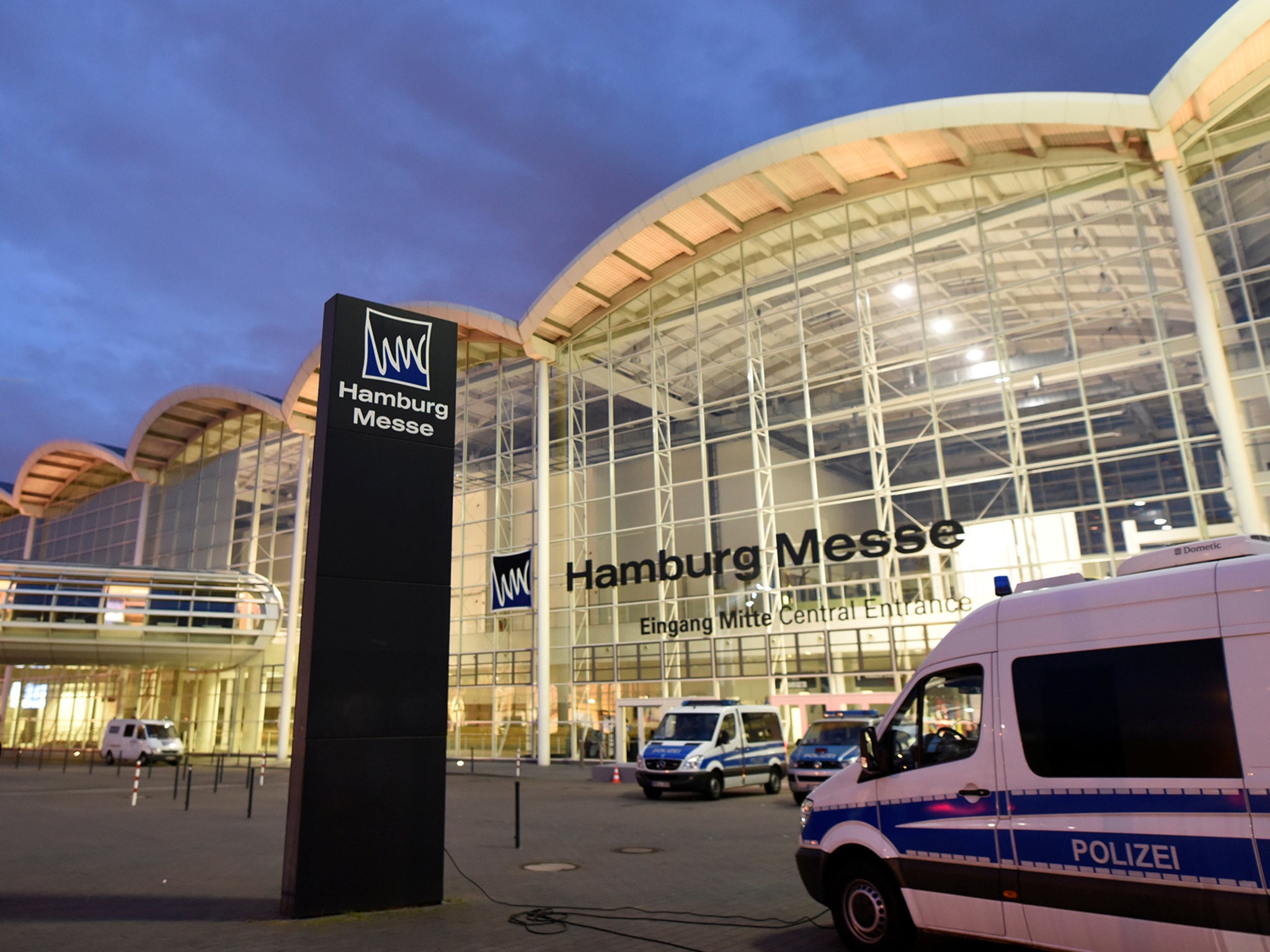 Police forces guard the fair ground where the upcoming G20 summit will take place, in Hamburg, Germany