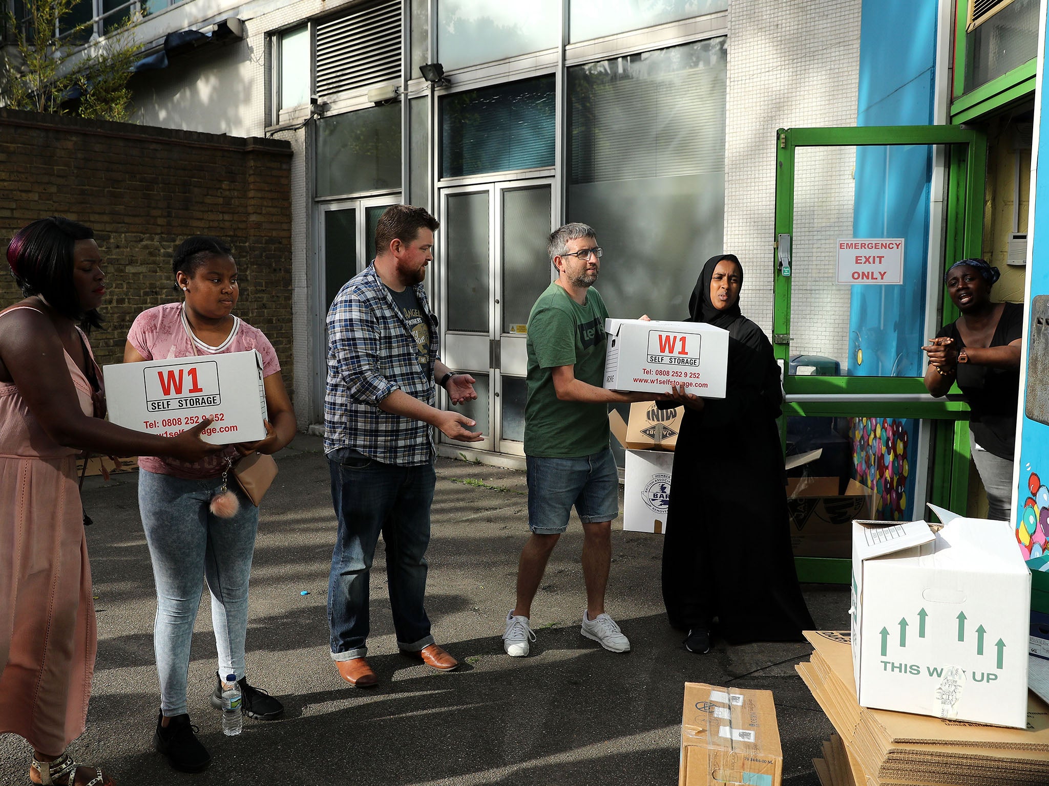 Volunteers distribute aid near Grenfell Tower (Getty)