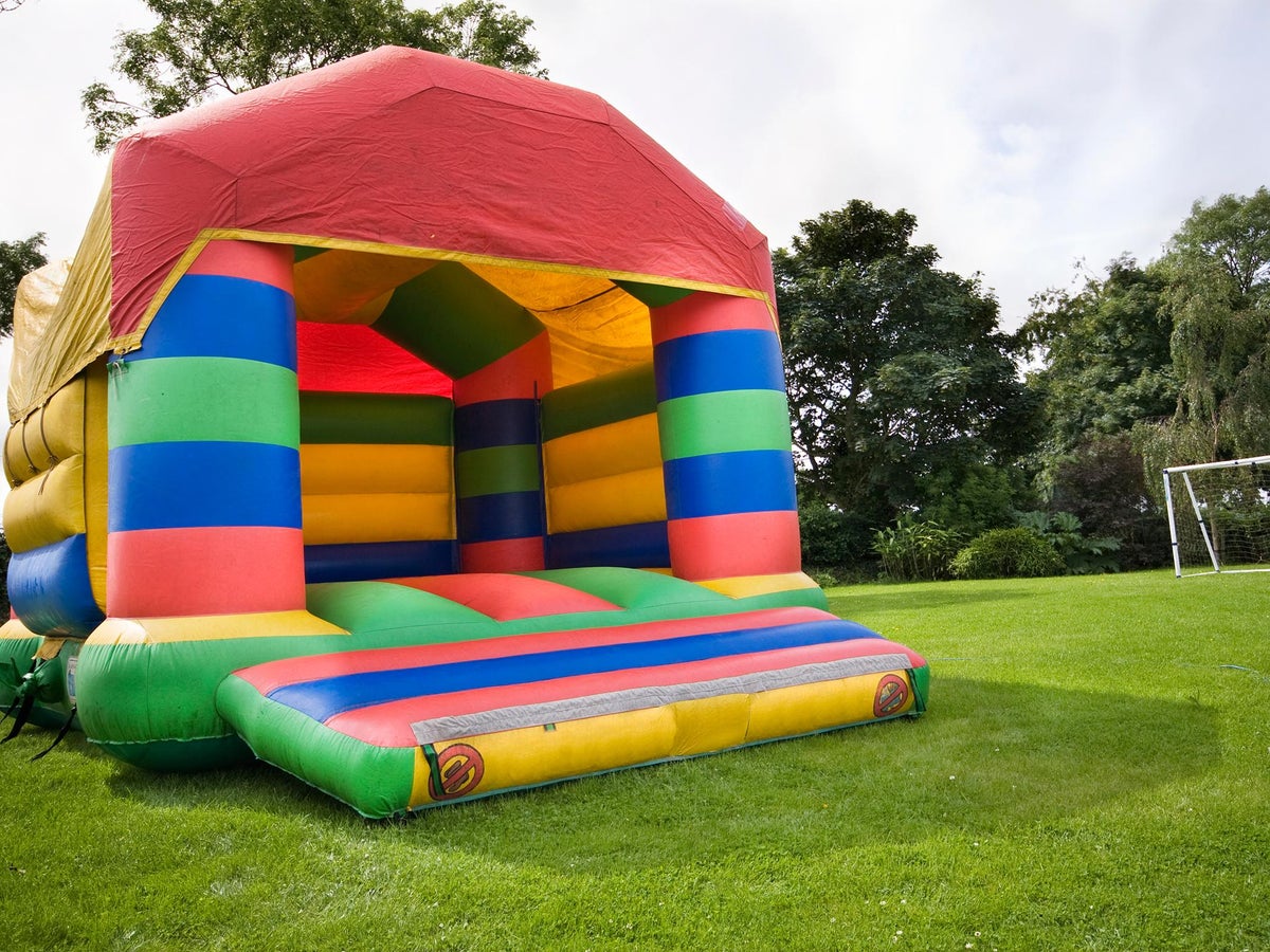 Two-year-old boy dies after getting swept away in bounce house by wind