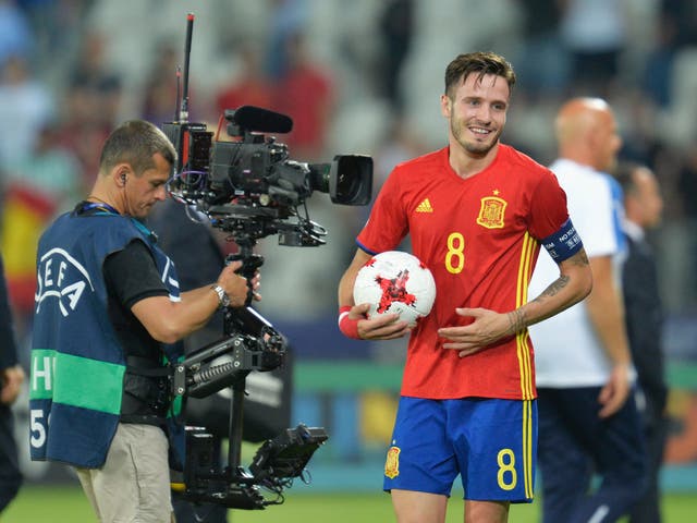 Saul Niguez claims the match ball after his semi-final hat-trick against Italy