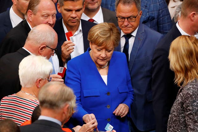 German Chancellor Angela Merkel and members of the lower house of parliament Bundestag vote on legalising same-sex marriage