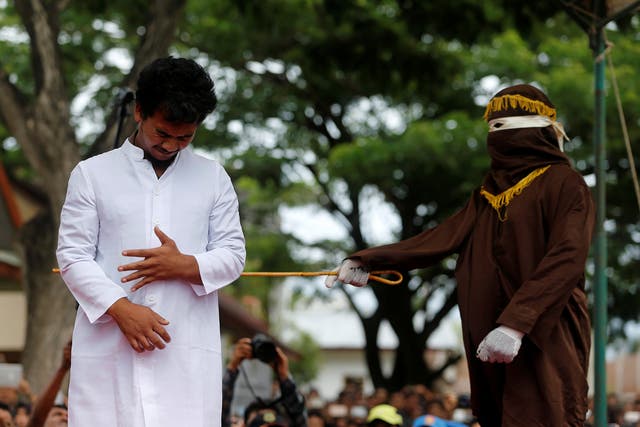 An Indonesian man is publicly caned for having gay sex