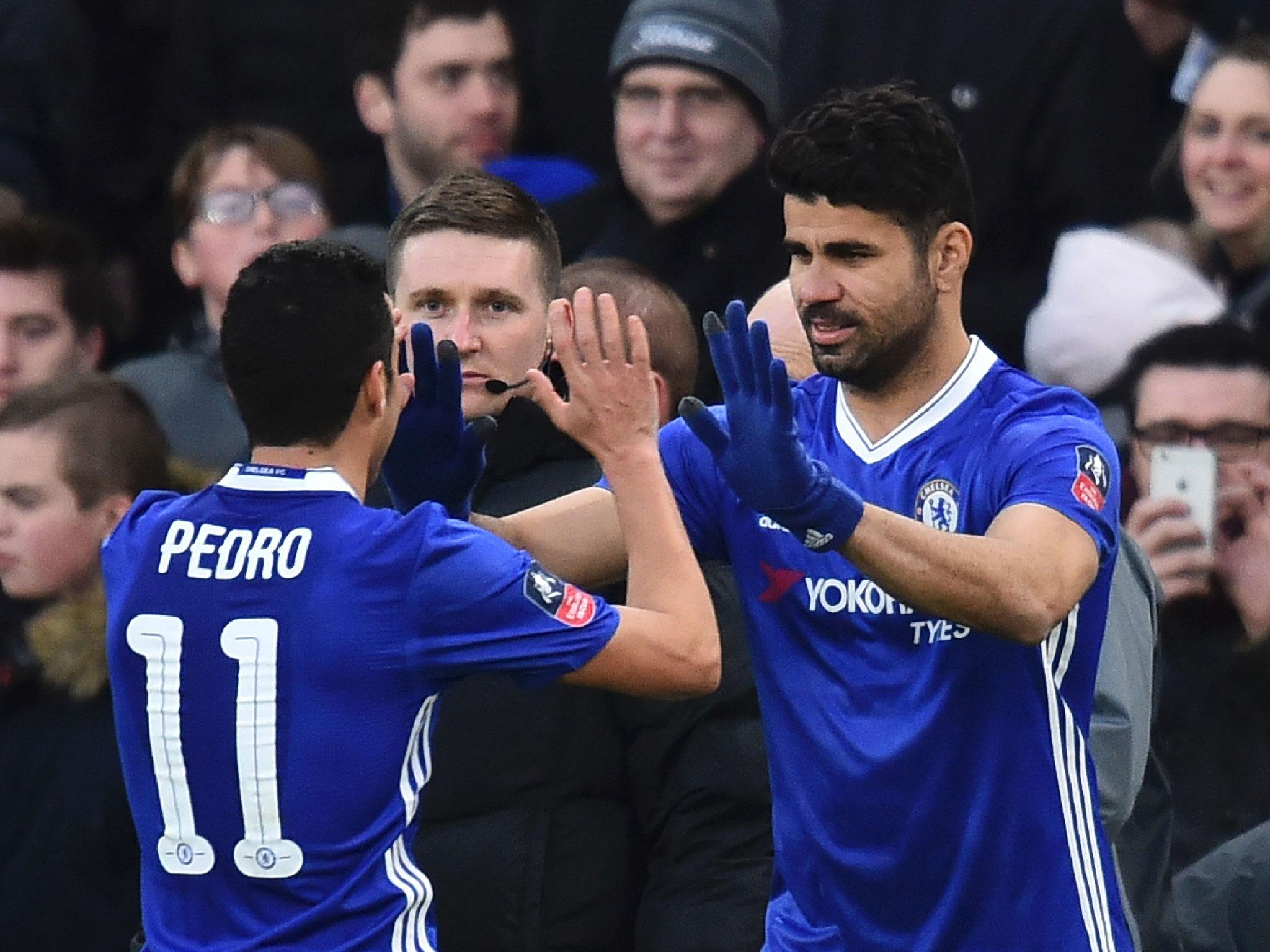 Diego Costa celebrates with Pedro after scoring a goal for Chelsea last season