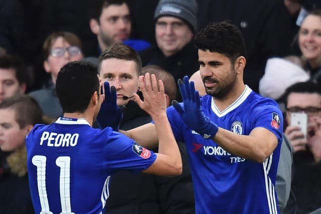 Diego Costa celebrates with Pedro after scoring a goal for Chelsea last season