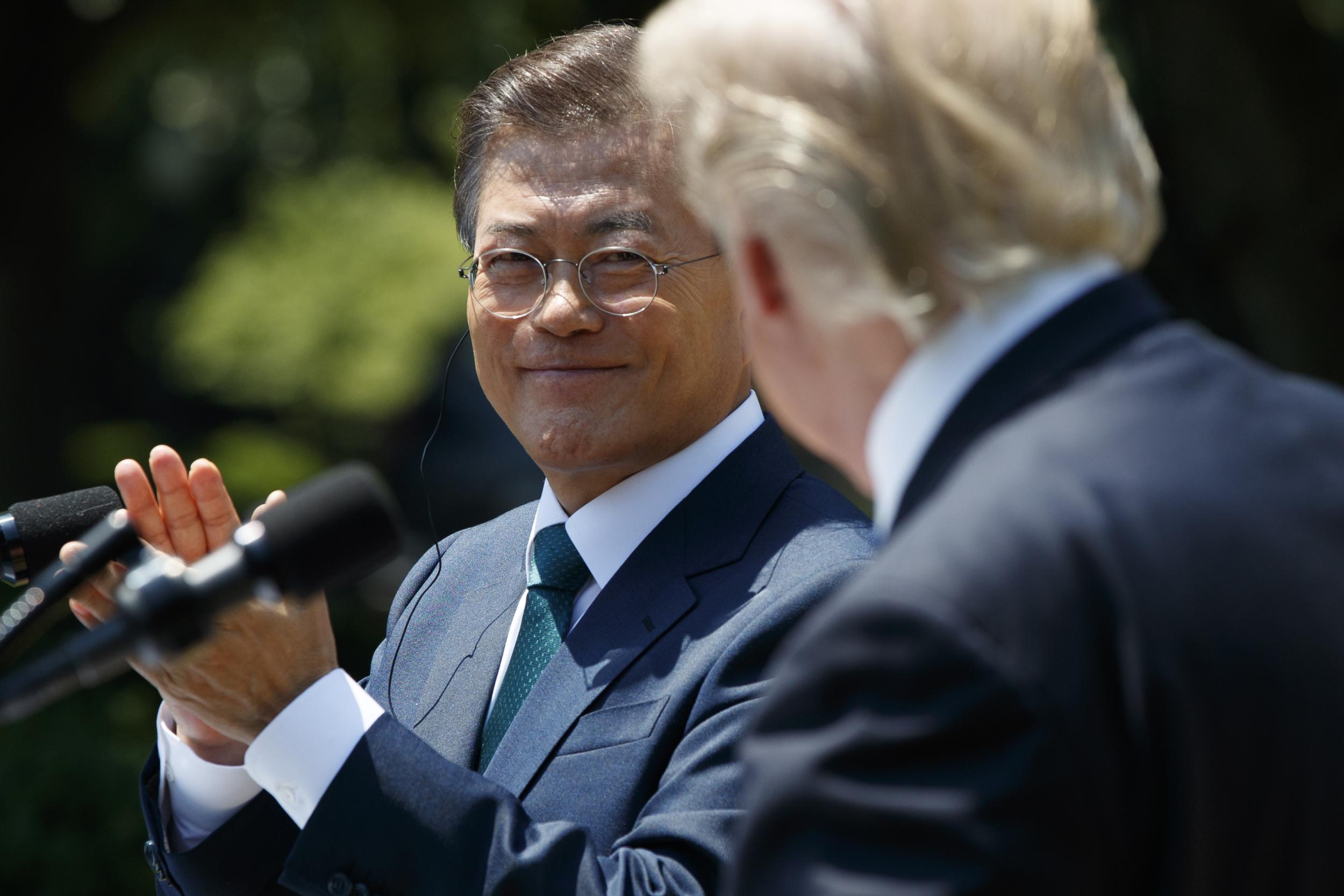 South Korean President Moon Jae-in applauds President Donald Trump
