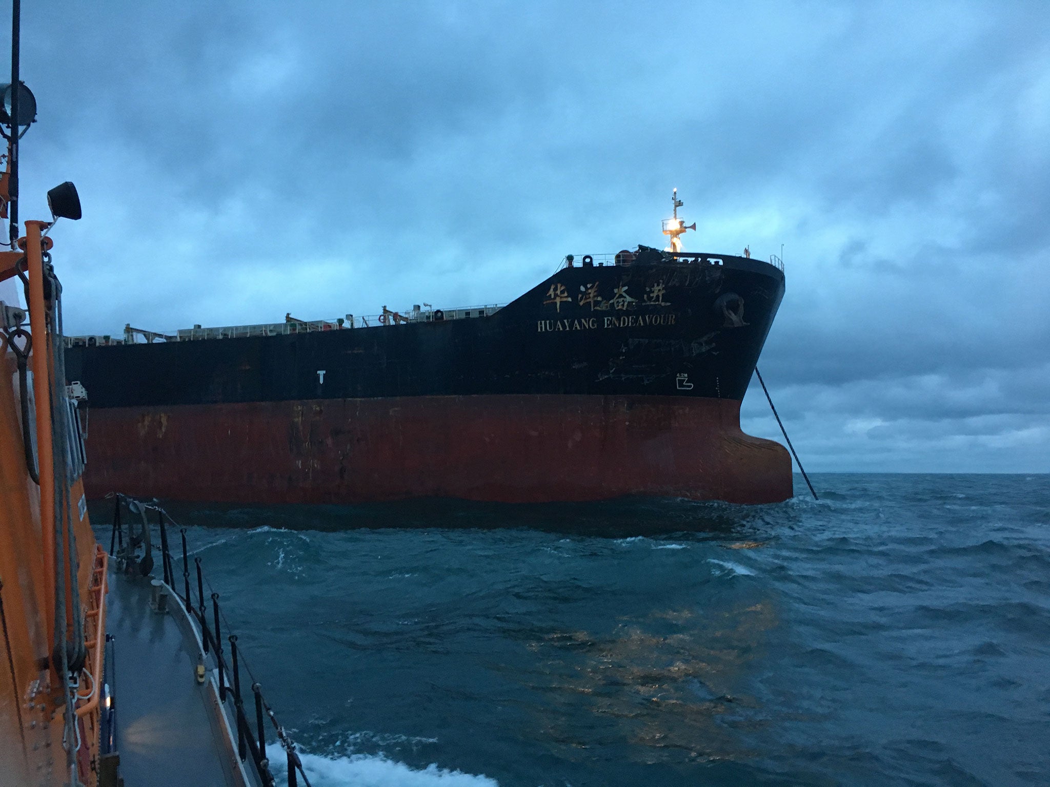 The Dover RNLI lifeboat stands off the Huayang Endeavour after a collision in the English Channel on 1 July 2017