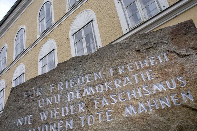 A memorial stone stands outside the house where Adolf Hitler was born in Braunau Am Inn, Austria