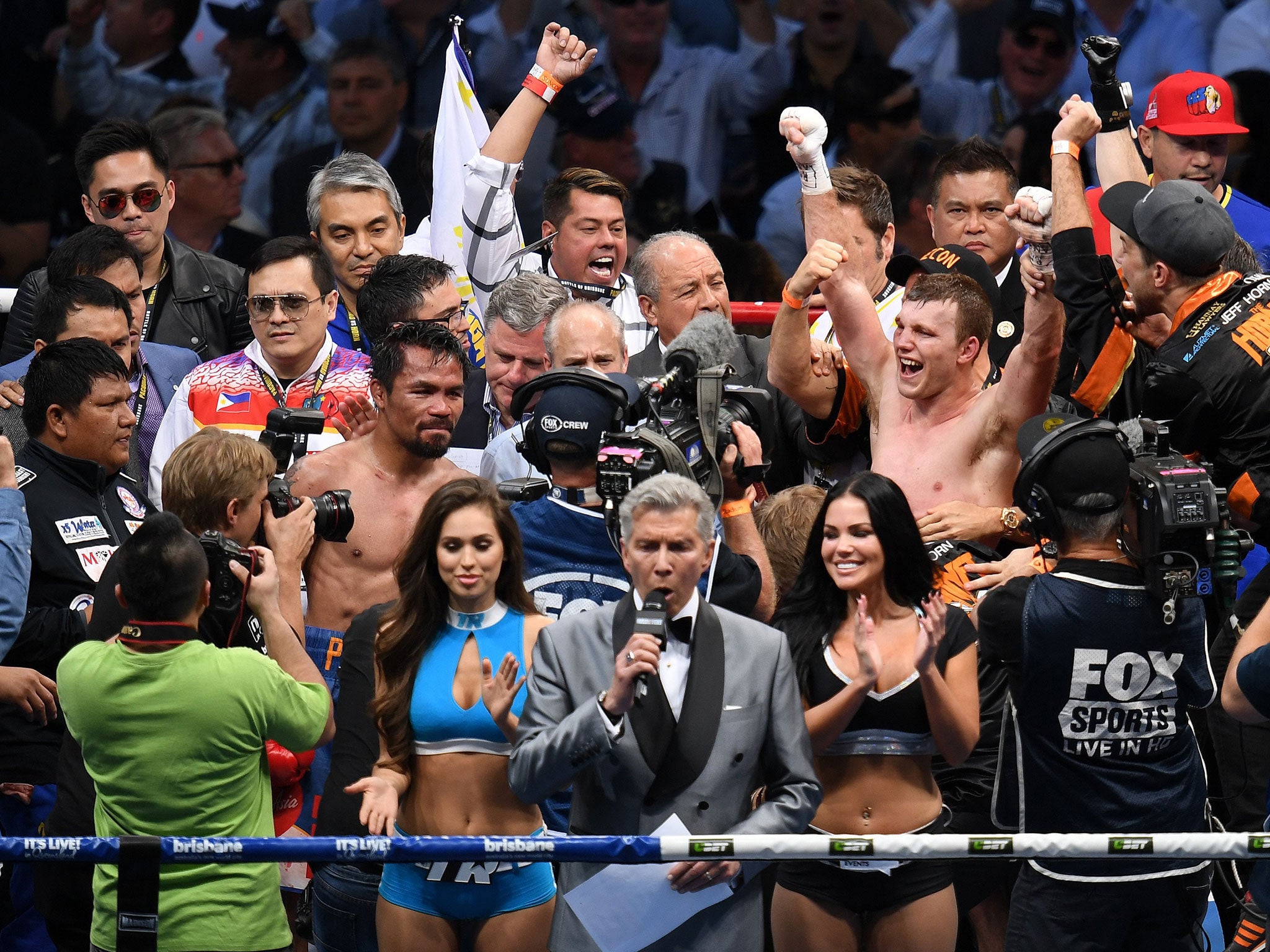 Jeff Horn (R) of Australia celebrates defeating Manny Pacquiao of the Philippines after their WBO World Welterweight title boxing match