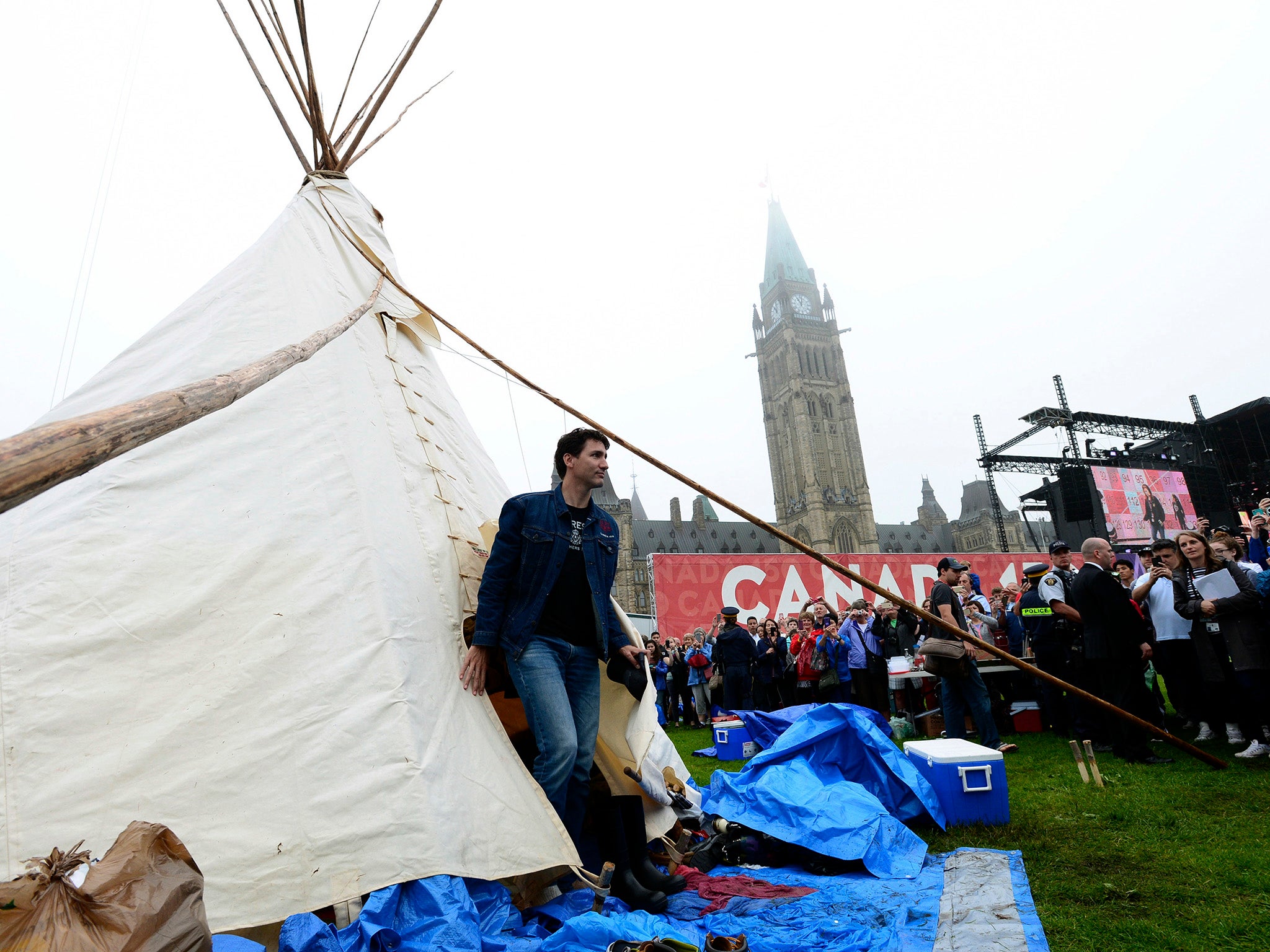 Prime Minister Justin Trudeau leaves a teepee on Parliament Hill in Ottawa, where he met with Indigenous activists protesting ahead of Canada Day celebrations