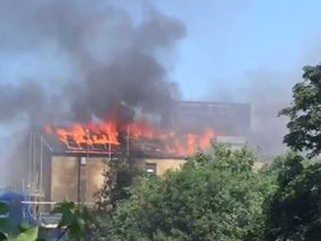 A huge blaze broke out at some unoccupied flats in Bethnal Green, east London