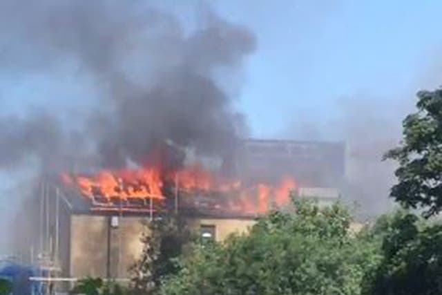A huge blaze broke out at some unoccupied flats in Bethnal Green, east London