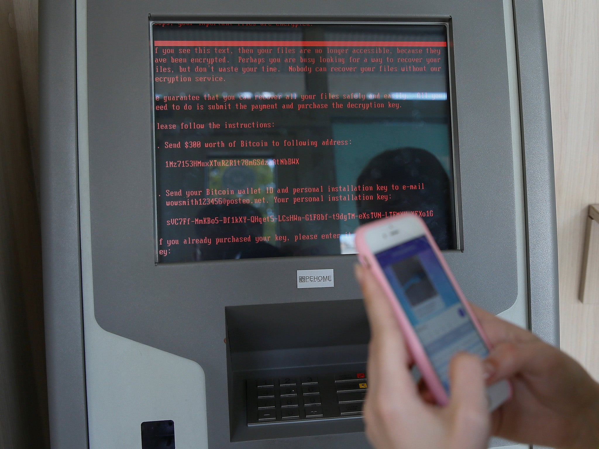 A ransom demand on a monitor of a payment terminal at Ukraine's state-owned bank Oschadbank