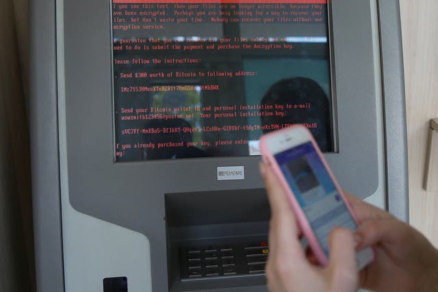 A ransom demand on a monitor of a payment terminal at Ukraine's state-owned bank Oschadbank