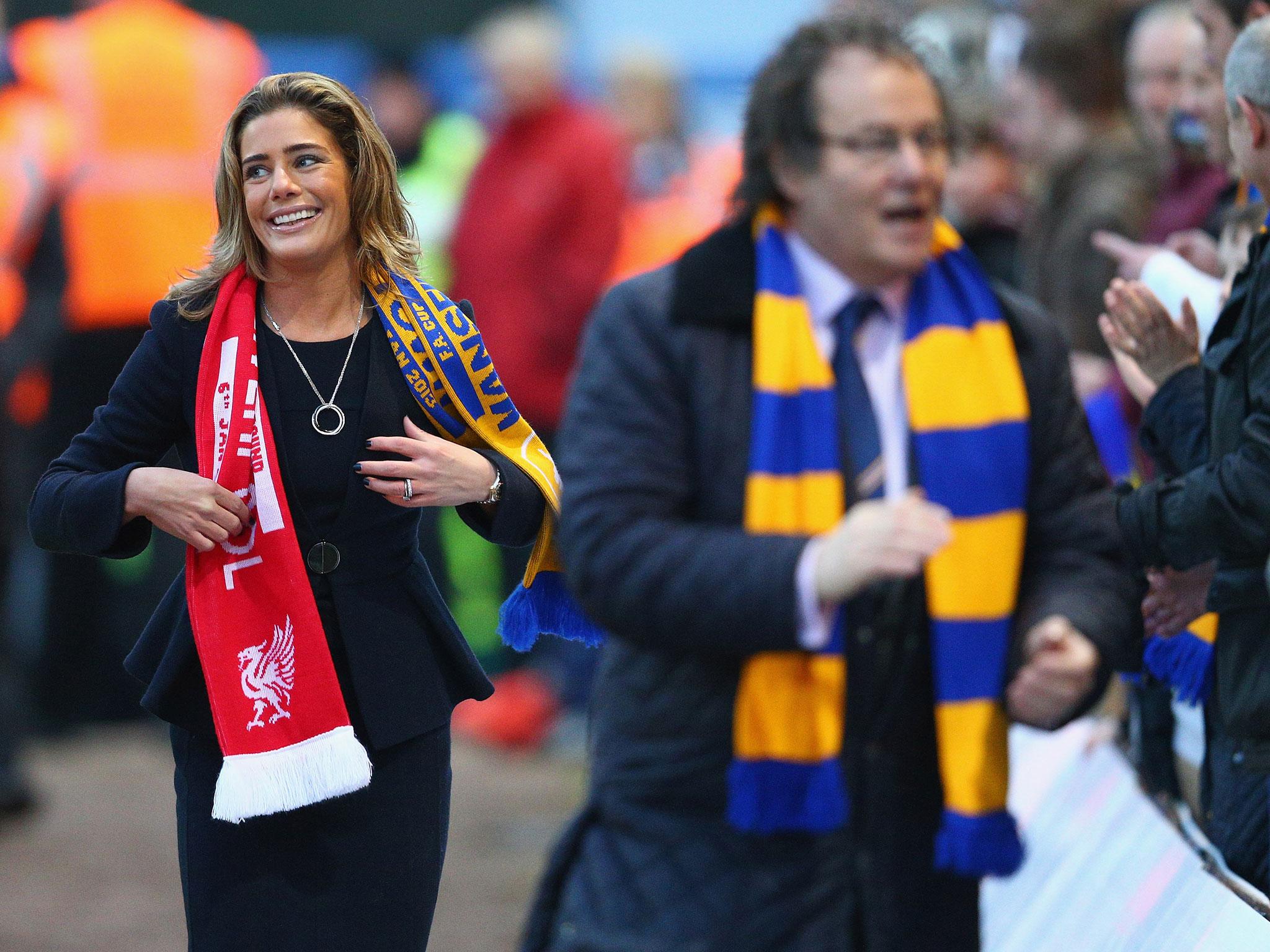 Carolyn Radford, with her husband John in the foreground, has called for greater female representation in the business side of football