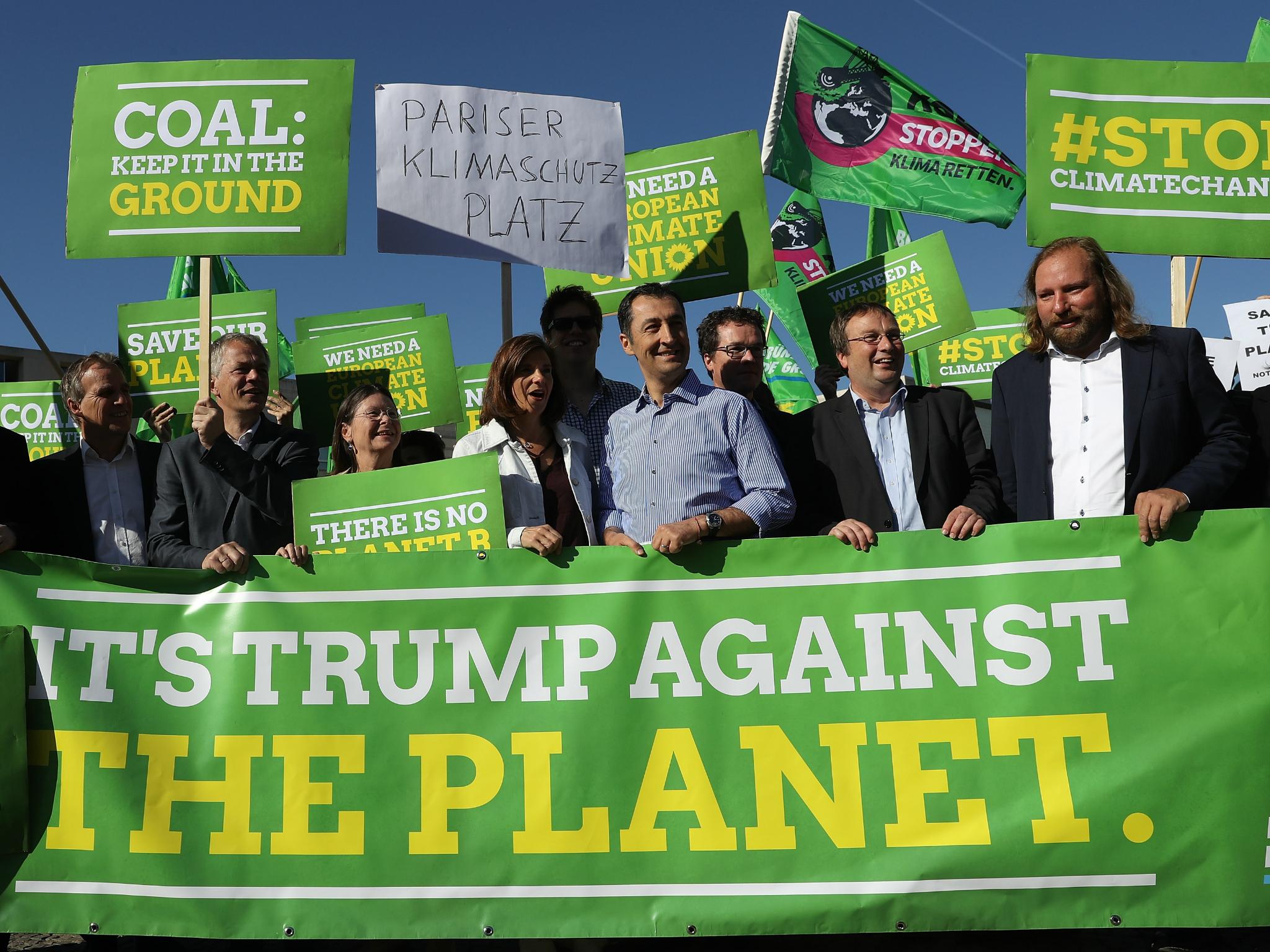 Members of the Green Party in Germany protest Donald Trump's withdrawal of the US from the Paris Agreement on climate change outside of the US Embassy in Berlin on 2 June 2017