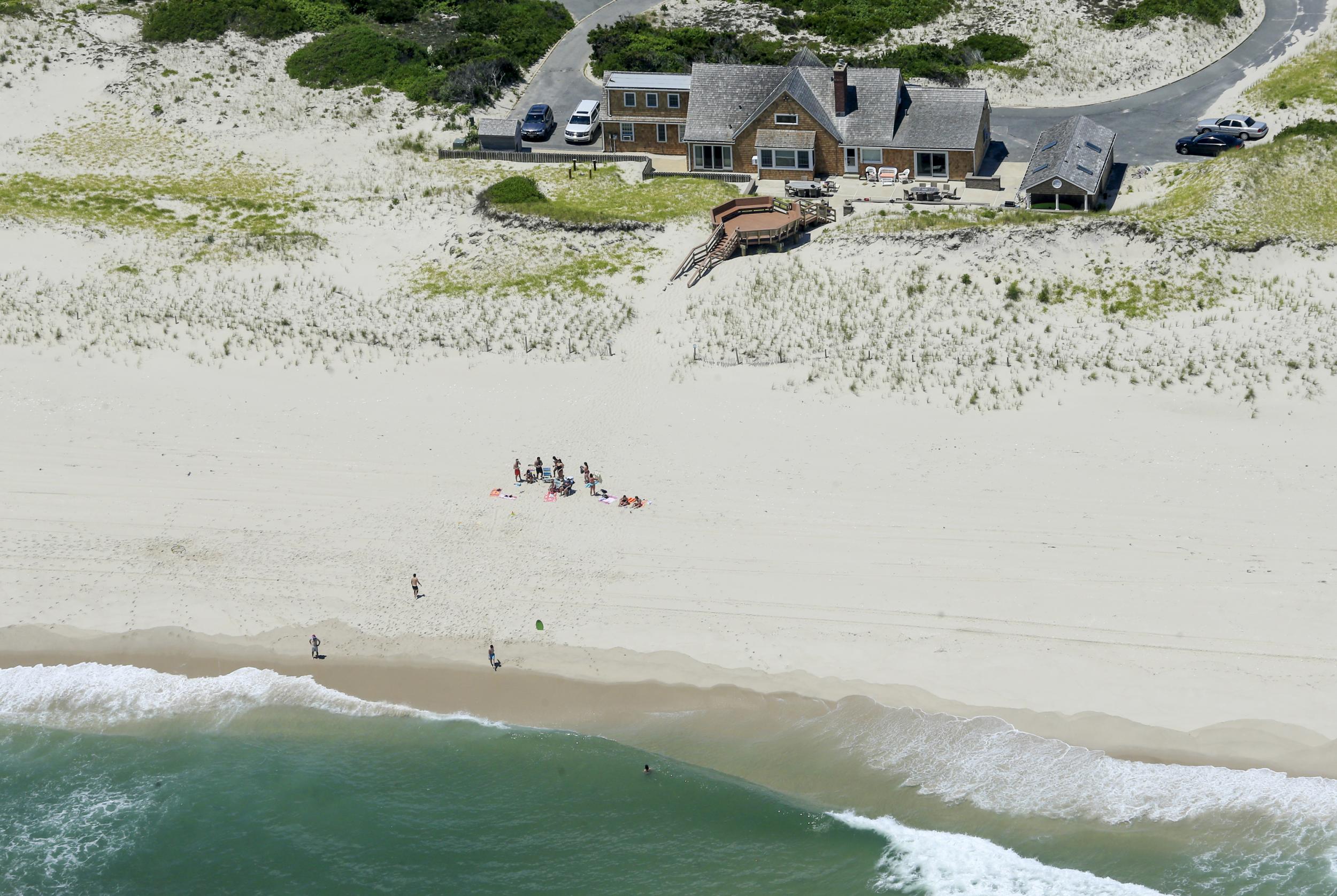 Christie was pictured enjoying a beach his government had closed