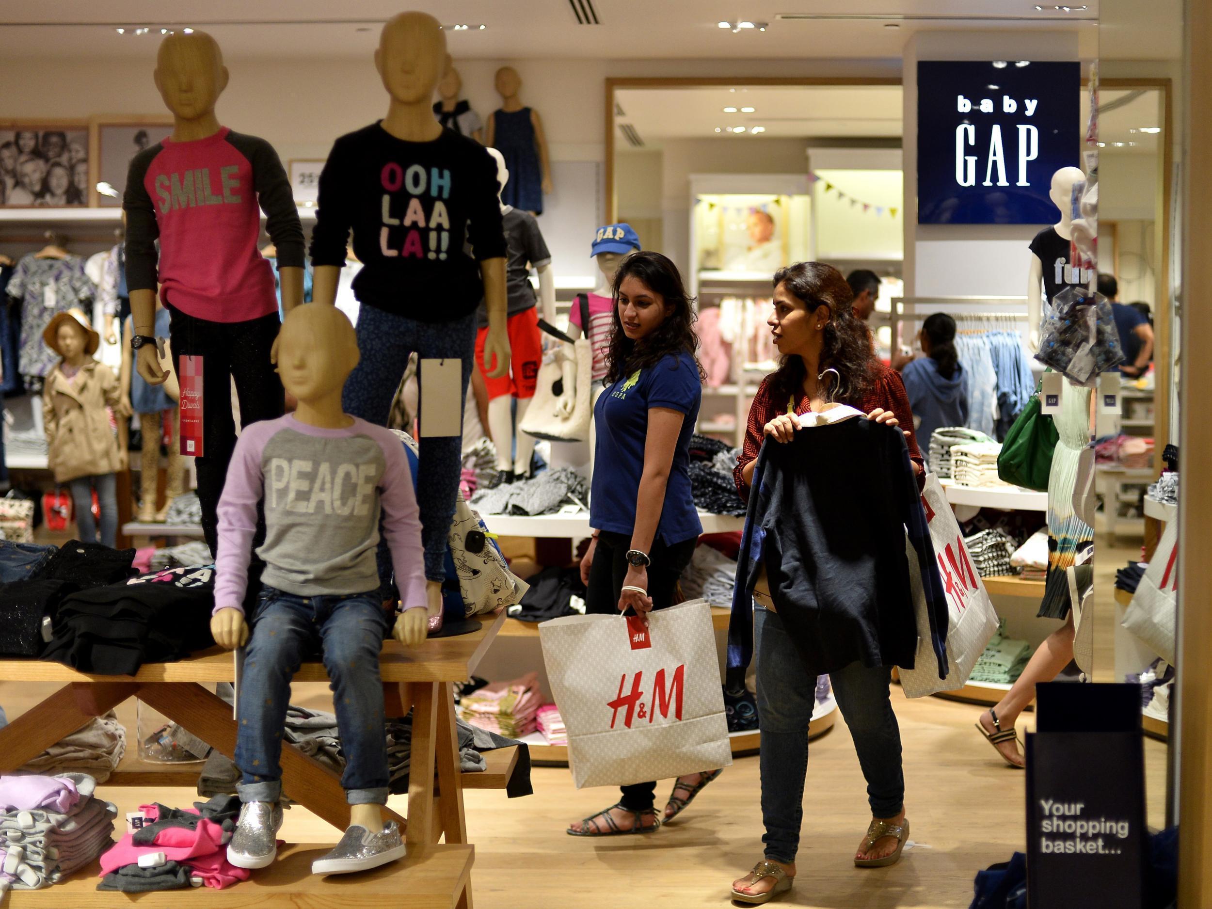 The village council claims women wearing Western dress increases the likelihood of them being attacked. Pictured: Women shopping in New Delhi