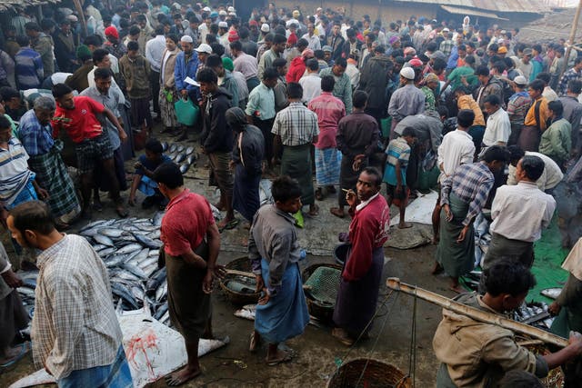 Rohingya men at Sittwe's bustling fish market in Rakhine, Burma