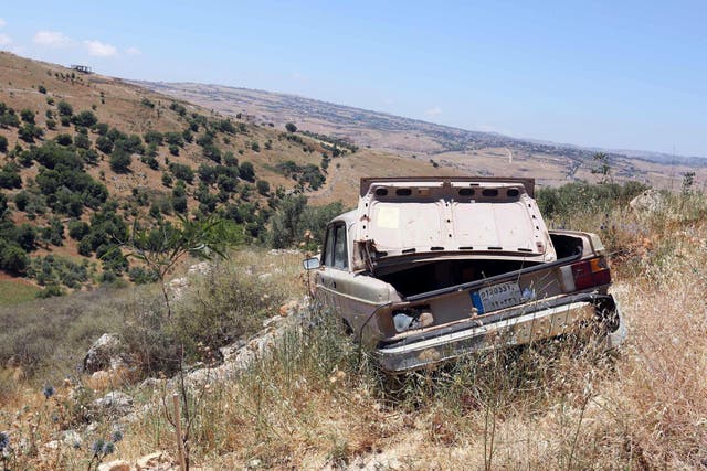An abandoned Volvo car is pictured at a field in Marjayoun village, southern Lebanon