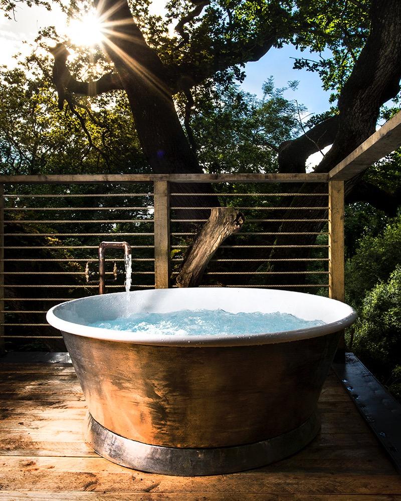 A hot tub for two on the upper spa deck