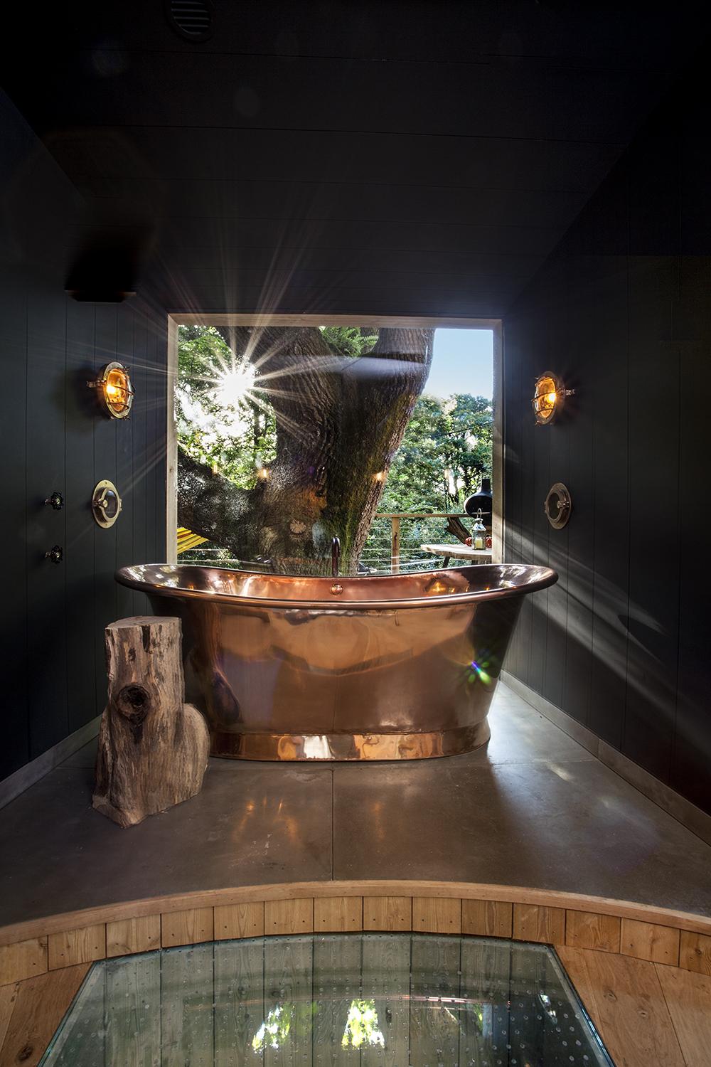 The outrageously deep copper tub overlooks the lower deck