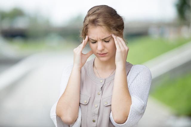 Woman suffering a stress headache