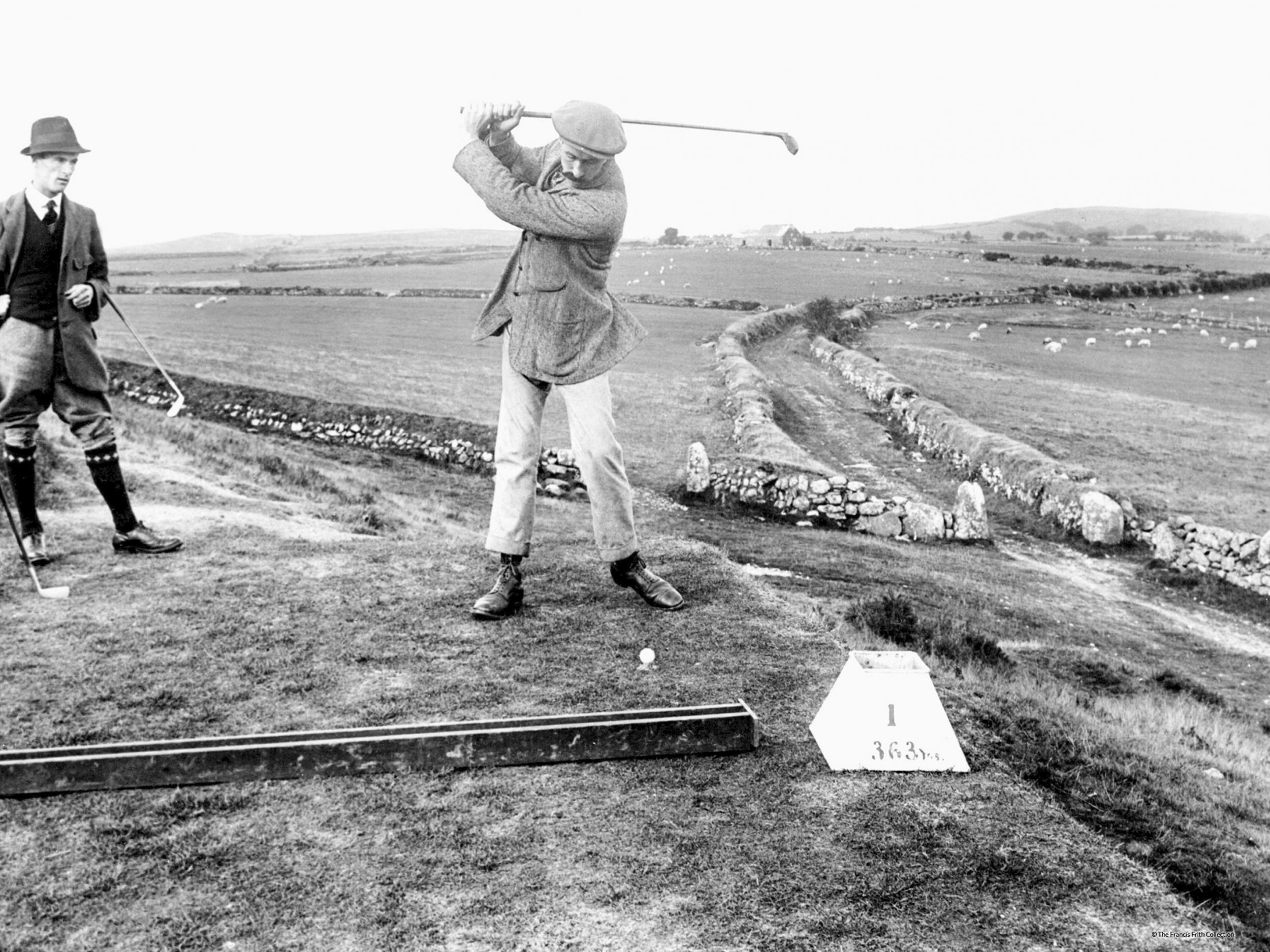 Two men play golf in Criccieth, Wales, in 1913