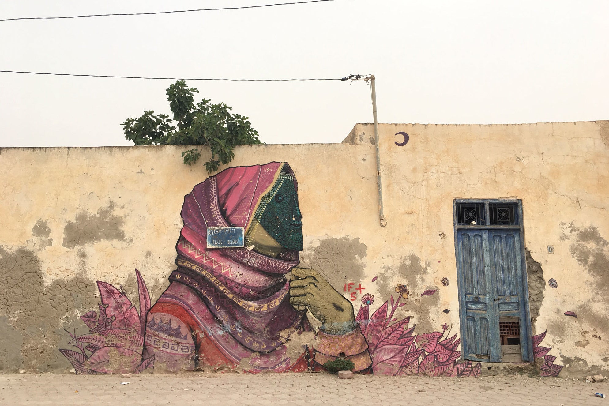 The walls of Erriadh are peppered with street art from a cultural identity project in 2014