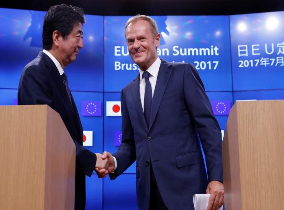 Japanese Prime Minister Shinzo Abe said the deal would 'fly the flag for free trade against a shift towards protectionism'