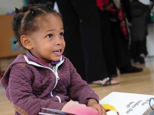 A girl reading on her own at the Canterbury Centre