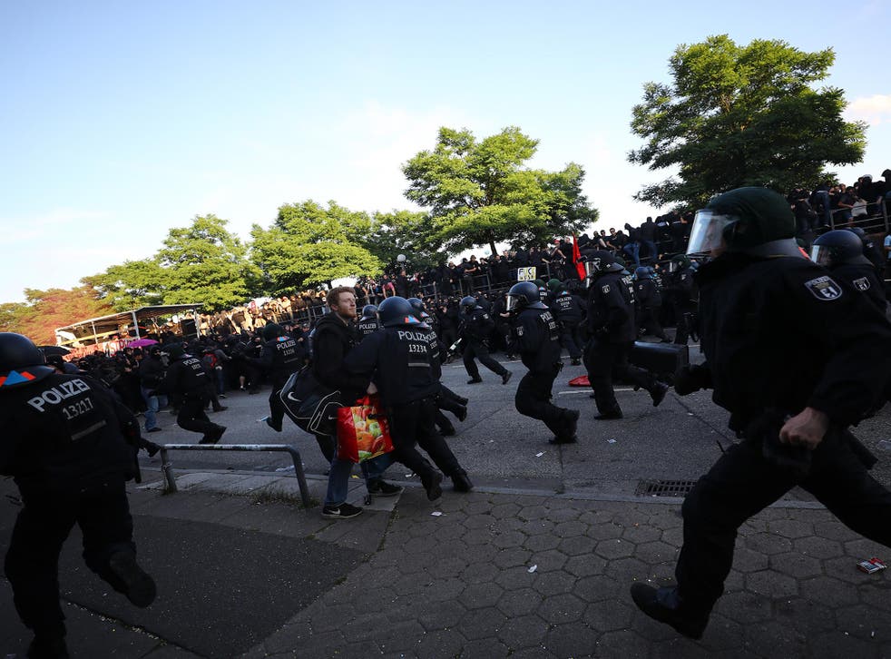 German riot police try to stop protesters during the demonstrations during the G20 summit in Hamburg,