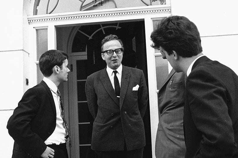 Makin (centre) talks to the press outside the home of Beatles manager Brian Epstein following his death in 1967. Makin earned his living, he said, by the sweat of his tongue
