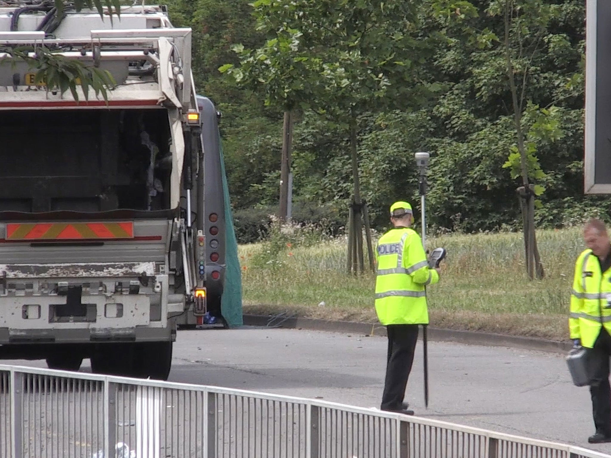 Police attending the scene of a fatal crash involving a school minibus and a bin lorry