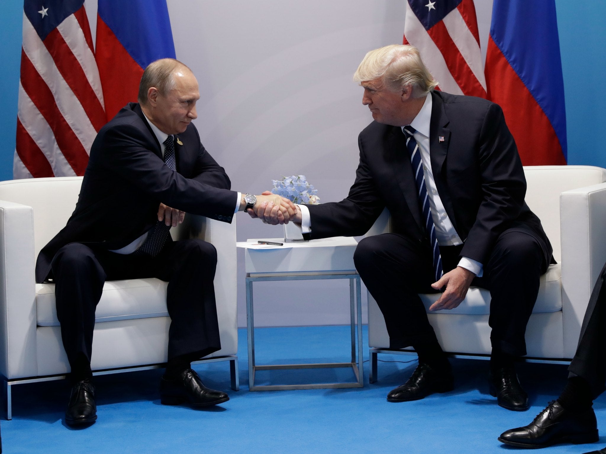 President Donald Trump shakes hands with Russian President Vladimir Putin at the G20 Summit ahead of their meeting