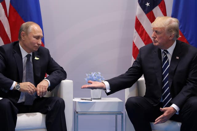 Russian leader Vladimir Putin (left) meeting US president Donald Trump