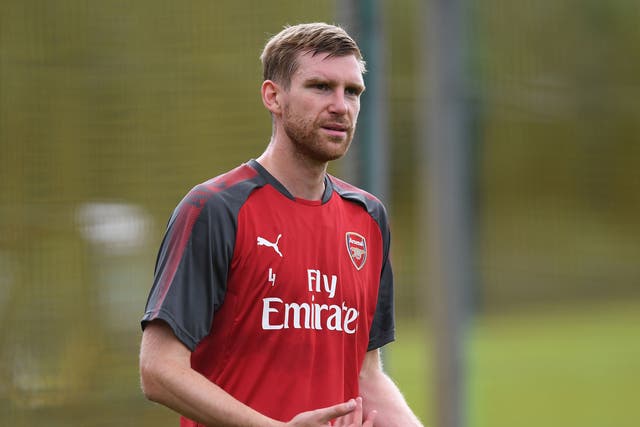 Per Mertesacker will end his playing career next year and join Arsenal's academy staff