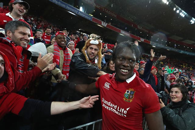 Maro Itoje celebrates the Lions' memorable victory in Wellington with fans