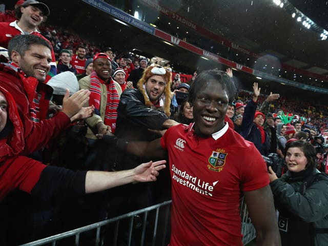 Maro Itoje celebrates the Lions' memorable victory in Wellington with fans