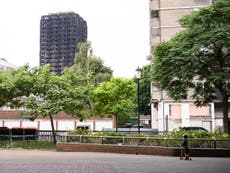 Survivors of the Grenfell fire hold silent walk around charred tower