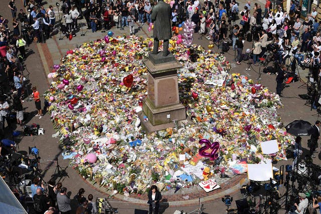 <p>Tributes were laid in the city centre in the aftermath of the atrocity</p>