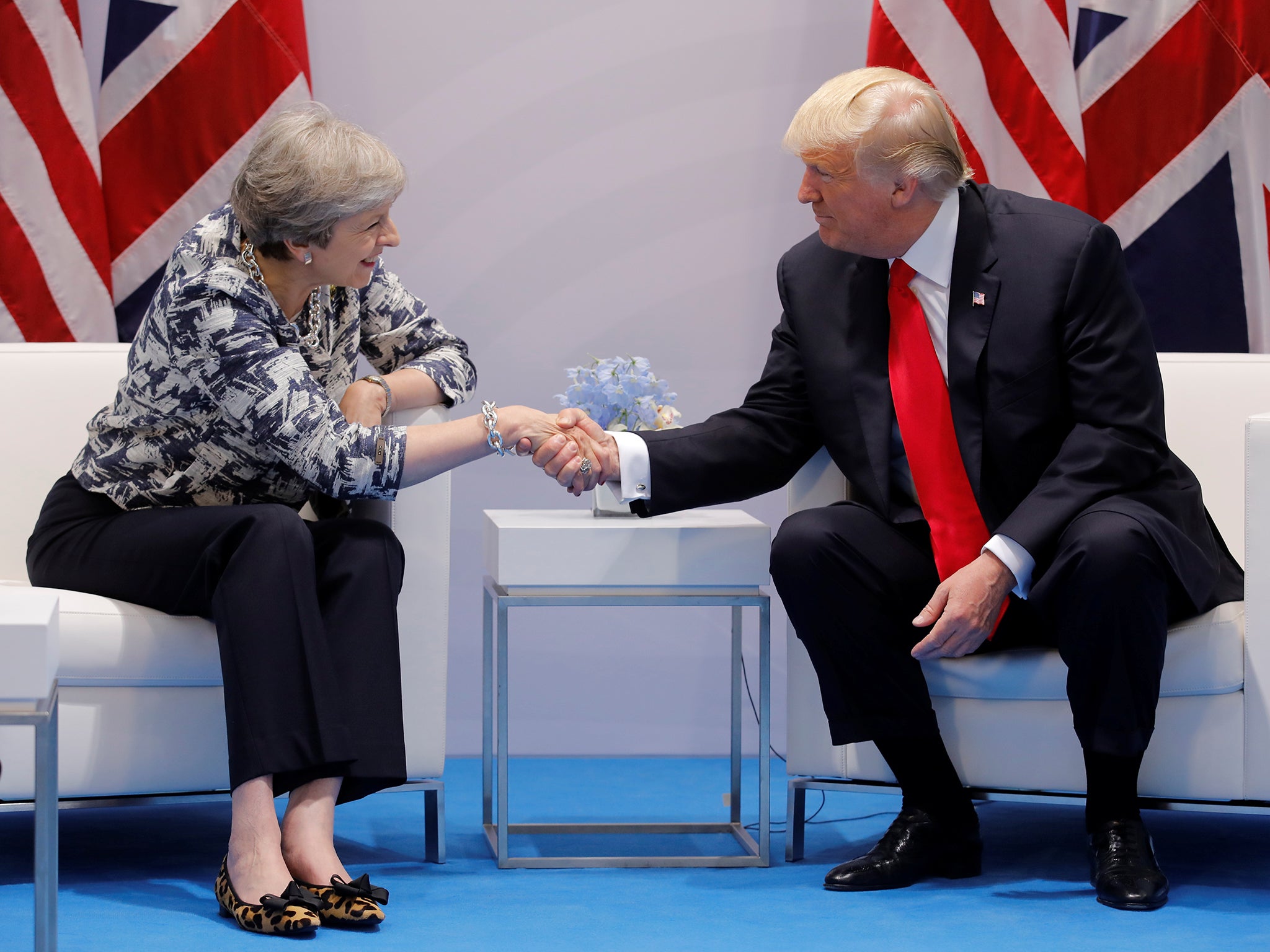Theresa May talks with Donald Trump during the G20 leaders' summit in Hamburg
