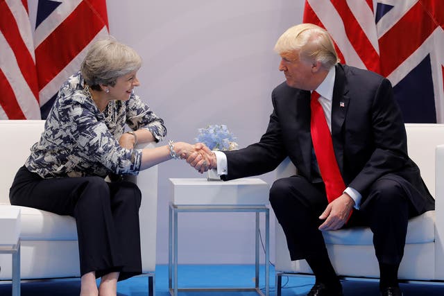 Theresa May talks with Donald Trump during the G20 leaders' summit in Hamburg