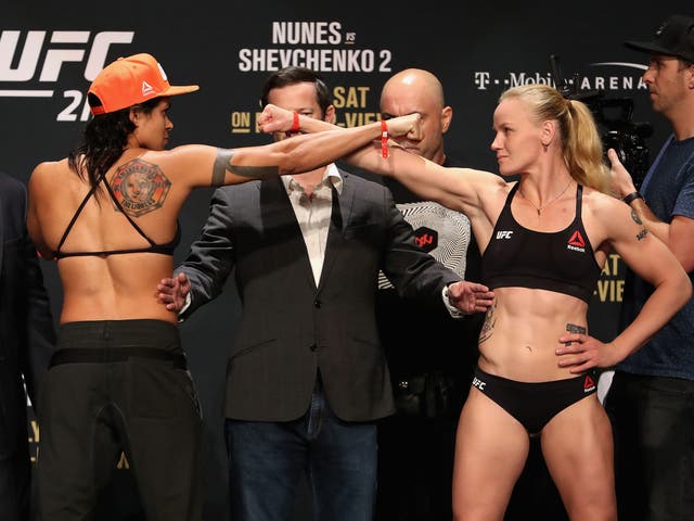 Amanda Nunes of Brazil and Valentina Shevchenko of Kyrgyzstan face off during the weigh-in
