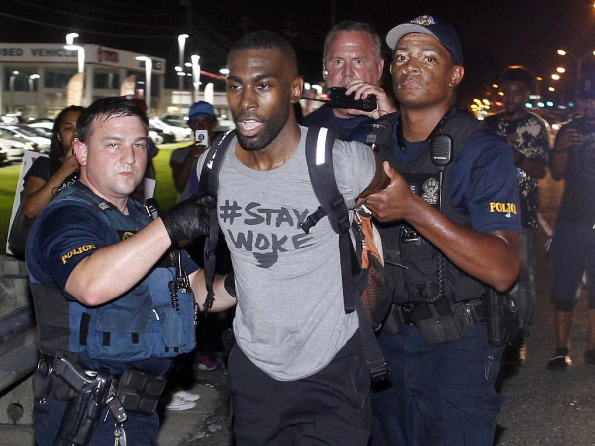 Black Lives Matter leader DeRay Mckesson, seen here in 2016, and four others are being sued by an unidentified Baton Rouge police officer for allegedly inciting and encouraging violence at demonstrations