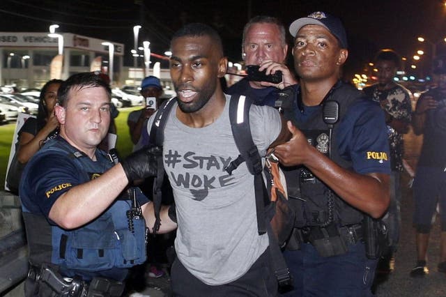 Black Lives Matter leader DeRay Mckesson, seen here in 2016, and four others are being sued by an unidentified Baton Rouge police officer for allegedly inciting and encouraging violence at demonstrations