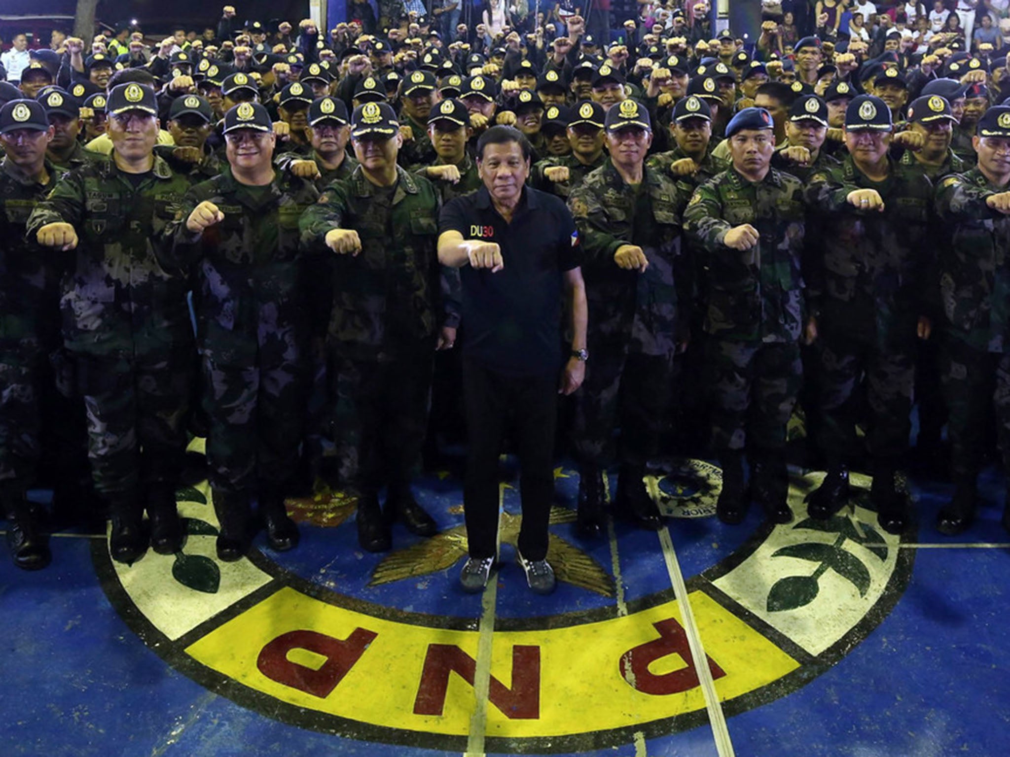 Duterte visits a police headquarters in Davao city. He came to office with a well-known record as a mayor who sanctioned death squads to dole out vigilante justice in his city