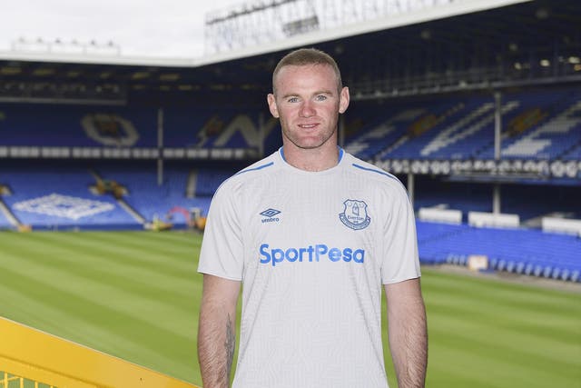 Wayne Rooney poses in Everton's new away shirt